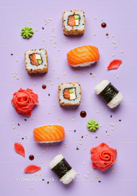 Colorful sushi assortment with garnishes on pastel background