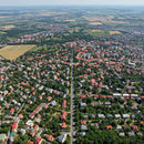 Aerial View of Residential Neighborhood with Greenery and Colorful Rooftops