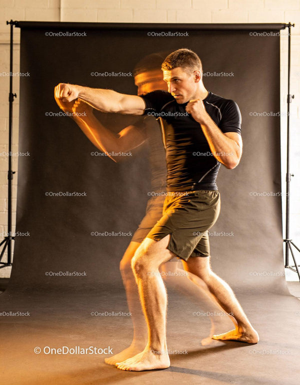 Focused Martial Artist Practicing Punching Techniques