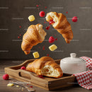 Fresh croissants with raspberry jam and butter on wooden tray
