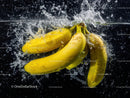 Fresh Yellow Bananas Splashing into Water a Vibrant Fruit Display