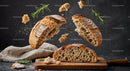 Rustic sourdough bread breaking apart with fresh rosemary
