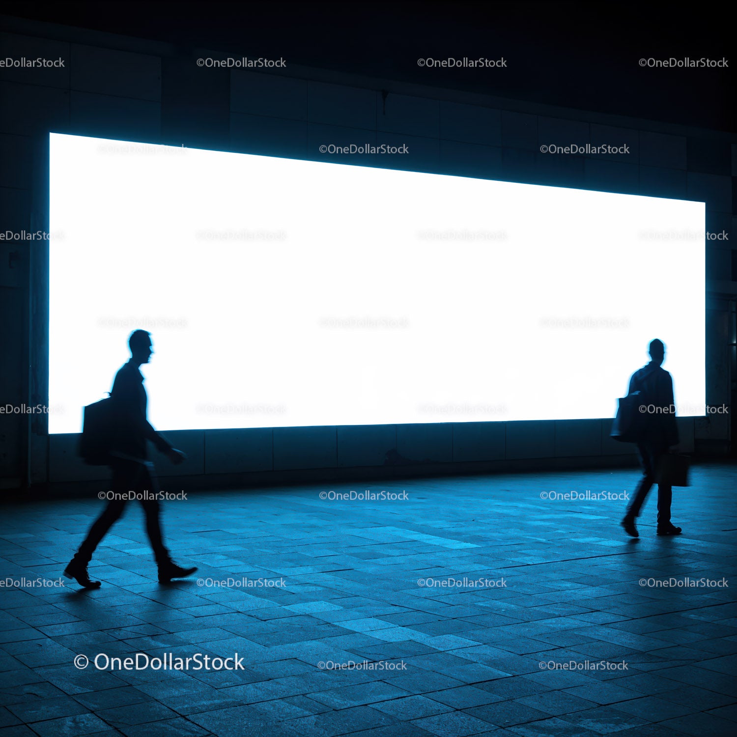 Silhouettes of Businessmen Walking Past Bright Billboard at Night