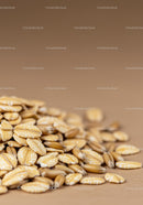 Close up of natural oat grains and flakes scattered