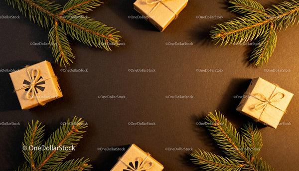 Festive gift boxes with pine branches on dark background