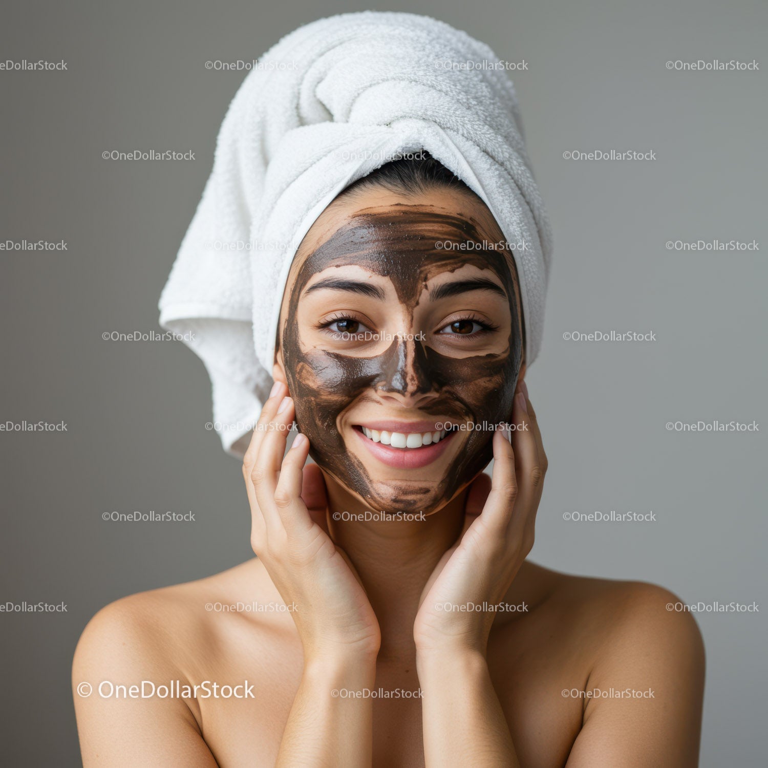 Young Woman Applying Clay Facial Mask for Skin Rejuvenation