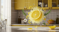 Fresh lemon splash with rosemary and ice in bright kitchen