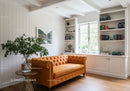 Cozy orange sofa in bright modern living room