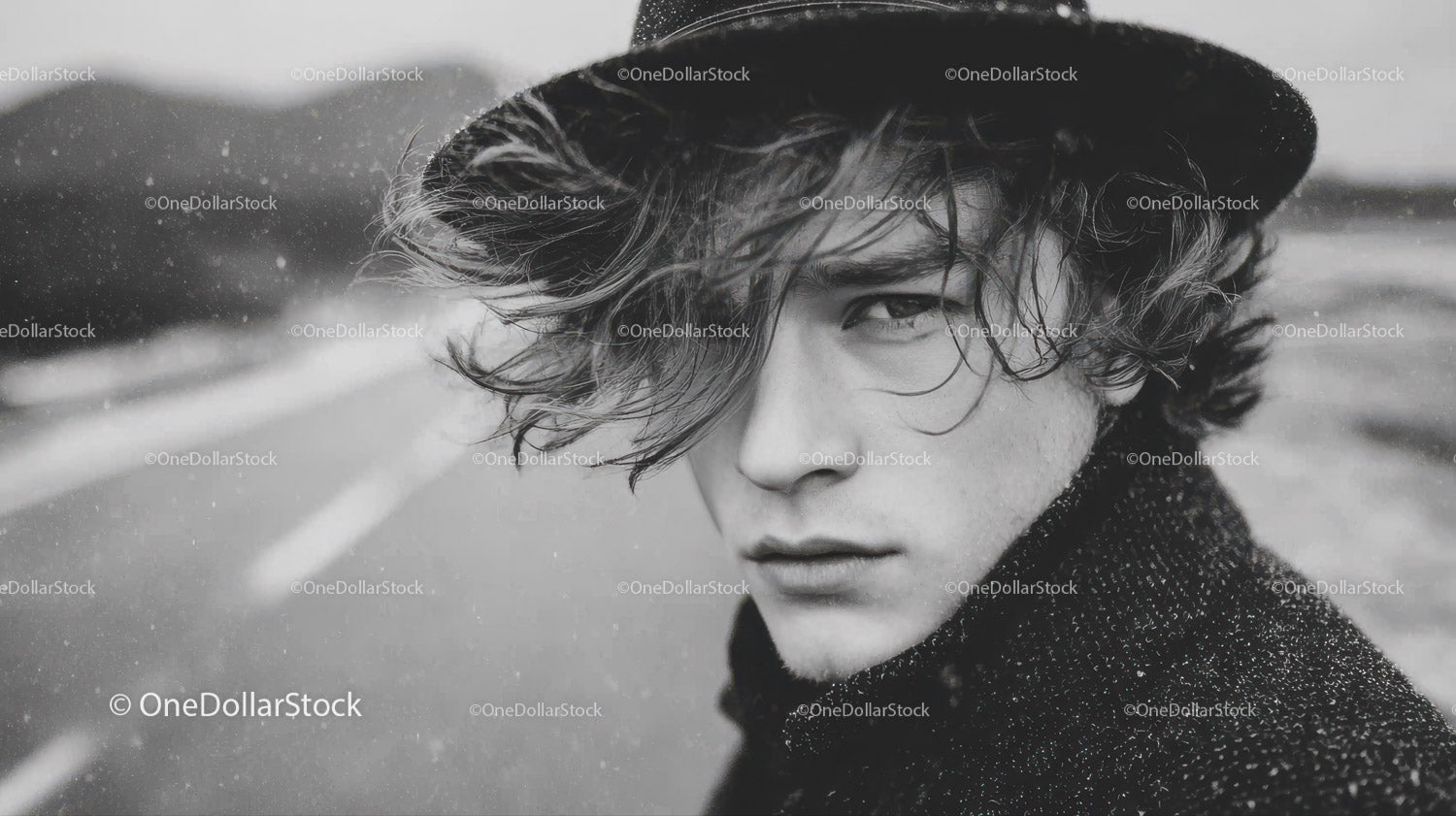 Black and White Portrait of Young Man with Wet Hair and Intense Gaze