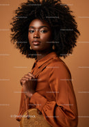 Elegant Black Woman with Curly Hair in Stylish Satin Blouse