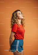 Young woman looking up in casual sporty outfit
