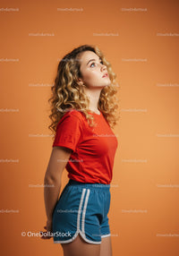Young woman looking up in casual sporty outfit