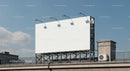 Blank Billboard Mounted on Rooftop Under Clear Sky