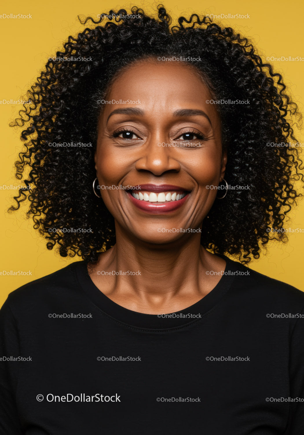 Portrait of a Smiling Black Woman with Curly Hair Against Yellow Background