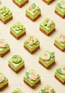 Assorted mini green tea mousse cakes with elegant decoration