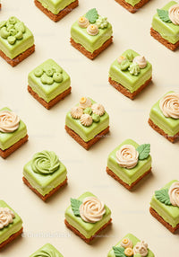 Assorted mini green tea mousse cakes with elegant decoration