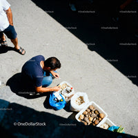 Man Preparing Street Food with Fresh Ingredients Outdoors
