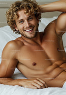 Smiling young man relaxing on white bed at home