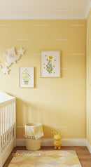 Bright Baby Nursery With Yellow Walls and Floral Wall Art