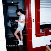 Young Woman Listening to Music with Classic Walkman