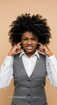 Frustrated Woman Covering Ears with Annoyed Expression