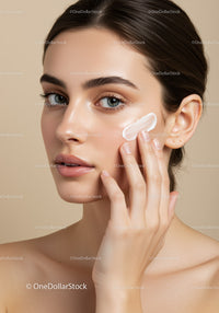 Young Woman Applying Facial Cream for Skin Rejuvenation