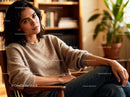 Thoughtful woman relaxing in cozy home setting