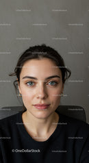 Portrait of a Young Woman with Blue Eyes and Dark Hair