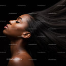Elegant woman with flowing natural hair and closed eyes