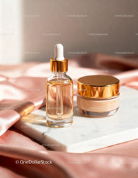 Luxury face serum and cream on marble with silk fabric