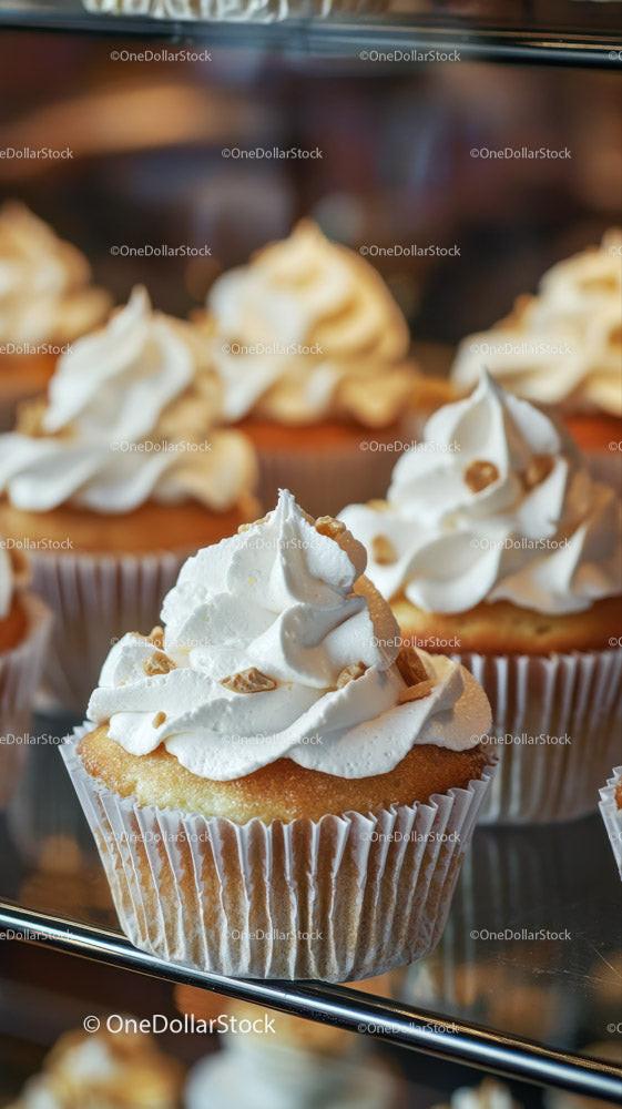 Delicious Vanilla Cupcakes with Caramel Topping on Bakery Display