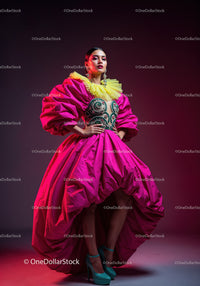 Fashion Model in Vibrant Pink and Yellow Flowing Gown