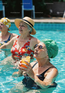 Elderly Women Relaxing and Drinking Refreshing Drinks in Pool