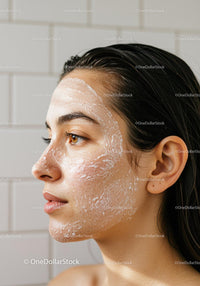 Close-up of young woman with facial cleanser foam