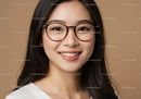 Young Woman Wearing Eyeglasses with Bright Smile in Studio