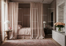 Cozy bedroom with soft curtains and elegant floral decor