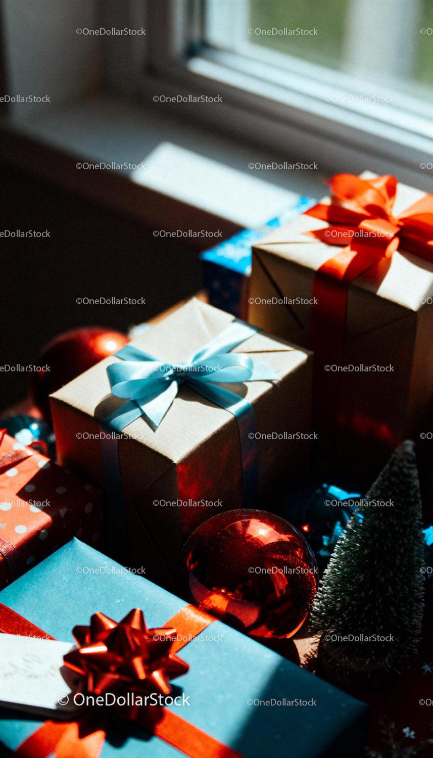 Festive gift boxes with ribbons and holiday decorations