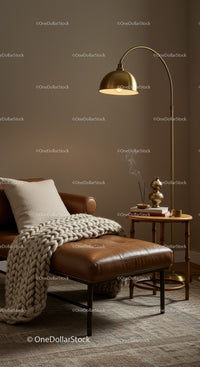 Cozy leather lounge chair with knitted blanket and warm lamp