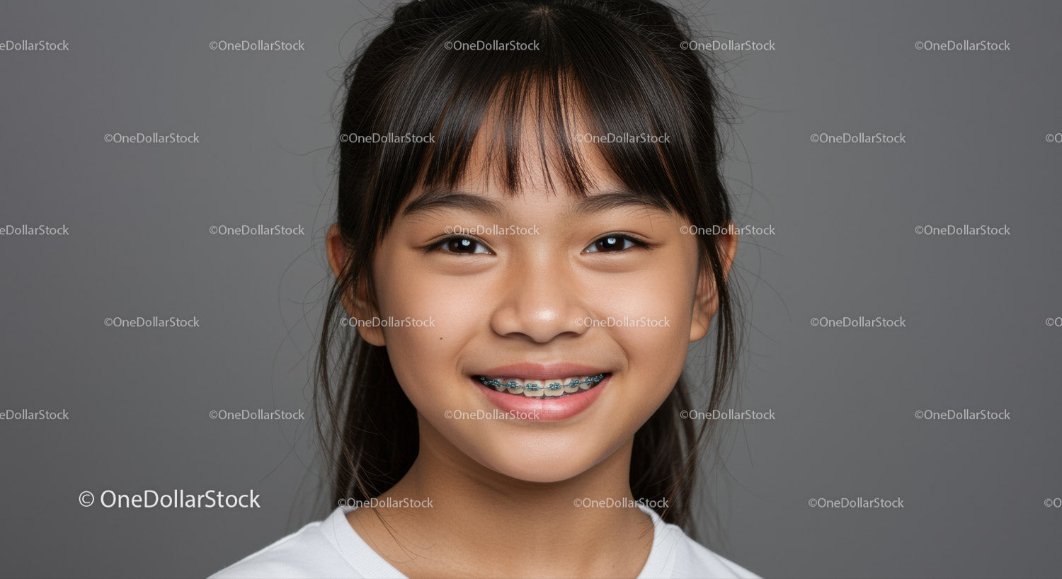 Smiling Girl with Braces Portrait in Gray Background