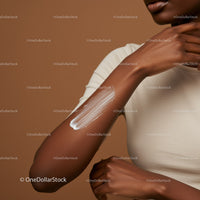Close-up of a Woman Applying Sunscreen Lotion on Arm for Sun Protection