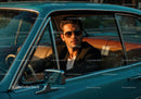 Stylish Man Driving Vintage Car with Sunglasses on Sunny Day