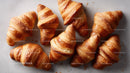 Fresh Golden Croissants on a Light Kitchen Surface