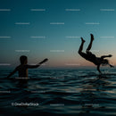 Playful Moments in the Water at Sunset