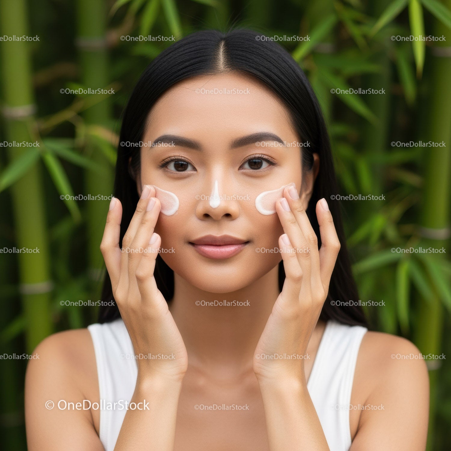 Young Woman Applying Face Cream with a Natural Background