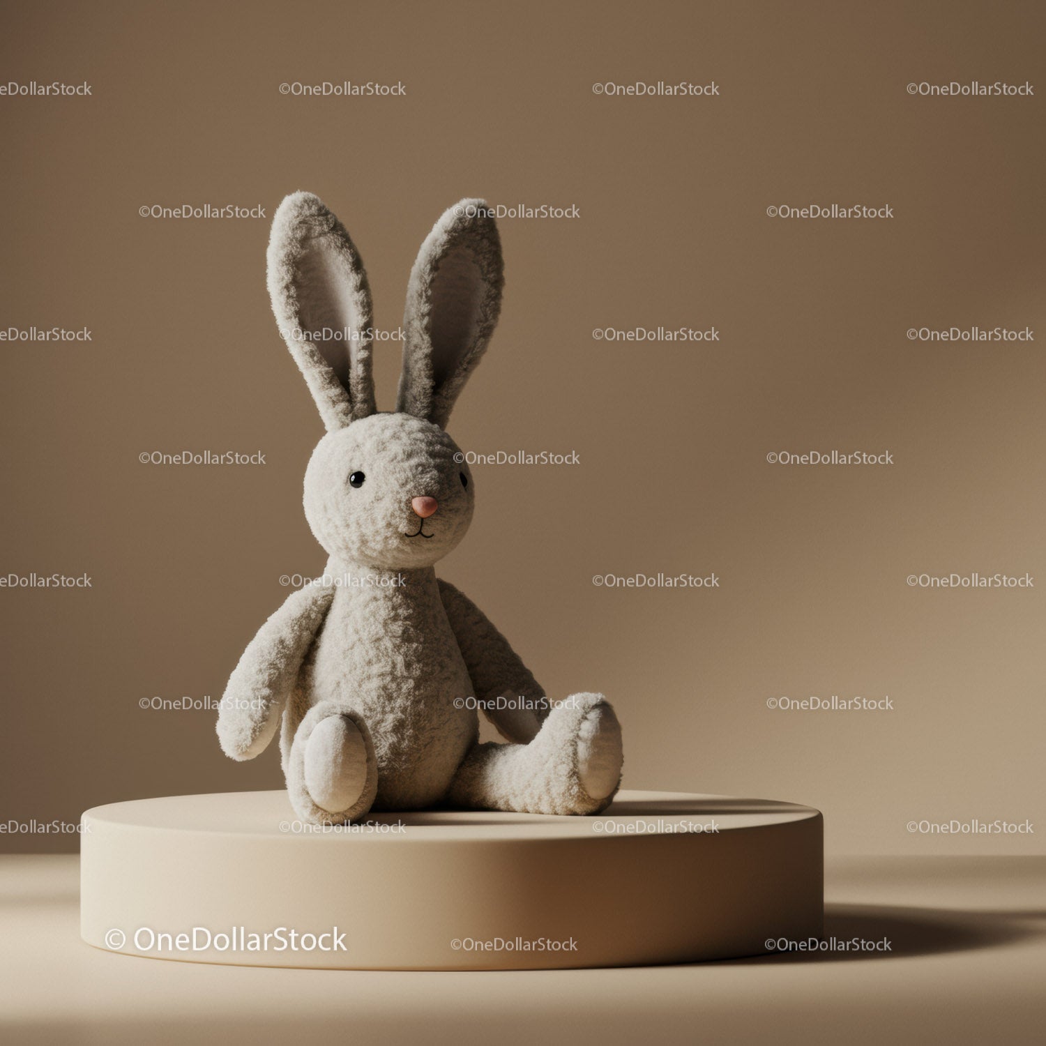 Soft plush bunny toy sitting on beige pedestal
