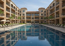 Modern Luxury Apartment Complex with Relaxing Swimming Pool and Tropical Landscaping