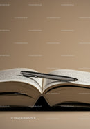 Open Book with Silver Pen on Table in Cozy Reading Space