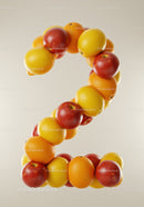 Number two composed of citrus fruits on light background