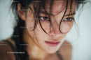 Close-up of Wet-Haired Woman with Intense Expression and Water Droplets