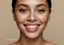 Closeup of smiling young woman with natural freckles